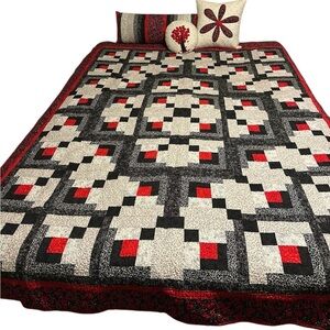 Quilt package includes one-of-kind quilt, bolster, 2 pillows.